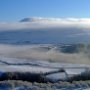 A snowy Ingleboro peeking through the clouds